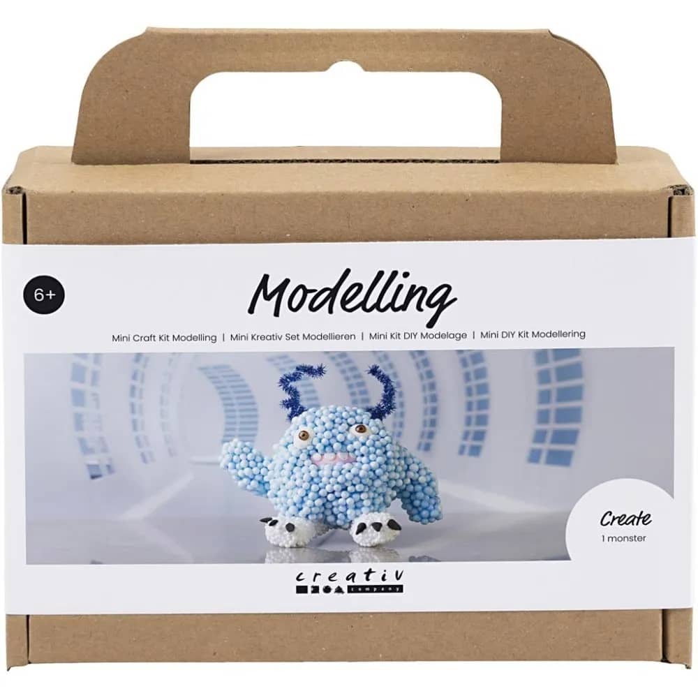 Knutselpakketje voor het boetseren van een grappig rond monstertje met grote ogen. 